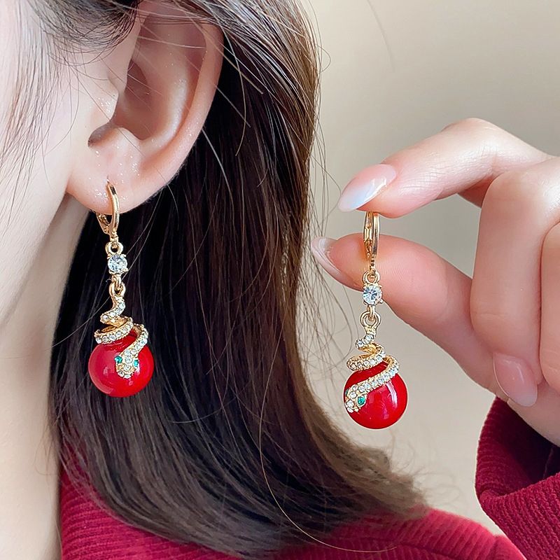 🐍Specjalna oferta noworoczna🎀 Kolczyki z pozłacanej perły w kształcie węża